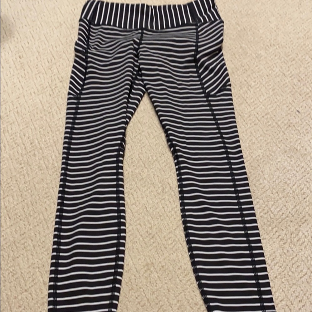 Athleta mid rise leggings 7/8.  Navy and white stripe.